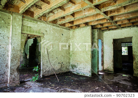 Remains of the destroyed San Lorenzo Hospital of the Armero Town buried by the avalanche up to the second floor after 37 years of the tragedy caused by the Nevado del Ruiz Volcano in 1985 90702323