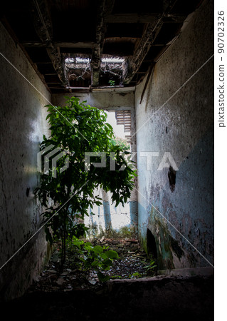 Remains of the destroyed San Lorenzo Hospital of the Armero Town buried by the avalanche up to the second floor after 37 years of the tragedy caused by the Nevado del Ruiz Volcano in 1985 90702326