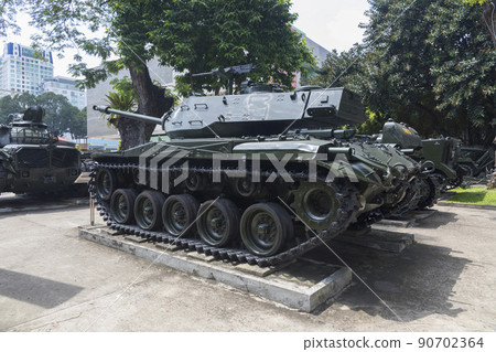 Ho Chi Minh, Vietnam - Oct 17, 2019 : Old tank and helicopter Chinookof United state army display at Vietnamese - American War Remnants Museum in Ho Chi Minh City, Vietnam on Oct 17, 2019. Ho Chi Minh, Vietnam - Oct 17, 2019 : Old tank and helicopter Chinookof United state army display at Vietnamese - American War Remnants Museum in Ho Chi Minh City, Vietnam on Oct 17, 2019. 90702364