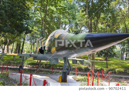 Ho Chi Minh, Vietnam - Oct 17, 2019 : Northrop F-5E Tiger fighter jet of the South Vietnamese Army displayed outside of the Reunification Palace in Ho Chi Minh City, Vietnam on Oct 17, 2019. 90702411