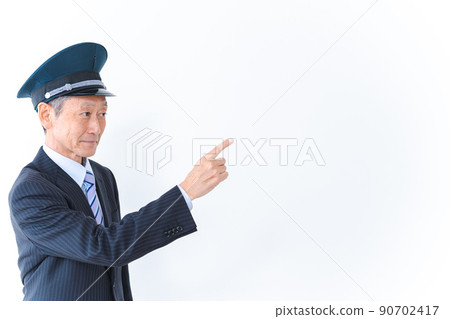Elderly conductor checking pointing 90702417