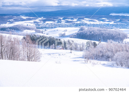 《Hokkaido》 Snow scene of Kamifurano, view of Senbo Pass 90702464