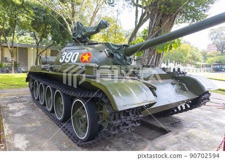 Ho Chi Minh, Vietnam - Oct 17, 2019 : Old tank and airplane at Reunification Palace in Ho Chi Minh City ,Vietnam on Oct 17, 2019. Ho Chi Minh, Vietnam - Oct 17, 2019 : Old tank and airplane at Reunification Palace in Ho Chi Minh City ,Vietnam on Oct 17, 2019. 90702594