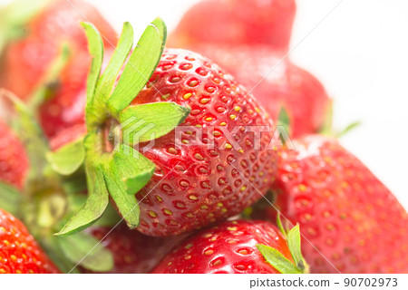 Few strawberries on a white background Few strawberries on a white background 90702973