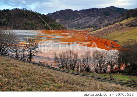 Pollution of a lake with contaminated water from a gold mine. 90703538