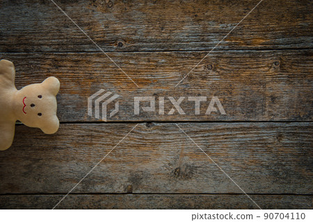 Adorable teddy bear on wooden background 90704110