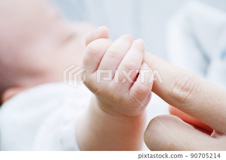 Newborn baby hand holding dads finger Stock Photo by ©Lakschmi 99674088