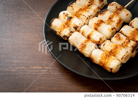 grilled tube shaped fish paste cake skewe or tube squid skewer grilled tube shaped fish paste cake skewe or tube squid skewer 90706314
