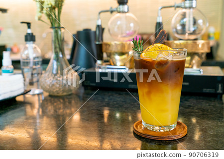 orange and lemon juice soda topped with black coffee orange and lemon juice soda topped with black coffee 90706319