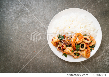 rice and stir-fried seafood with Thai basil 90706391