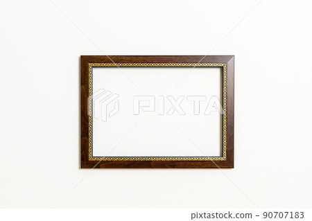 empty picture frame on white wall background 90707183