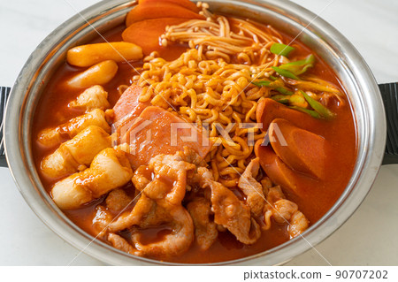 Budae Jjigae or Budaejjigae (Army stew or Army base stew). It is loaded with Kimchi, spam, sausages, ramen noodles and much more Budae Jjigae or Budaejjigae (Army stew or Army base stew). It is loaded with Kimchi, spam, sausages, ramen noodles and much more 90707202