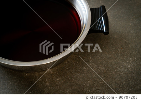 black soup in hot pot for shabu or sukiyaki 90707203
