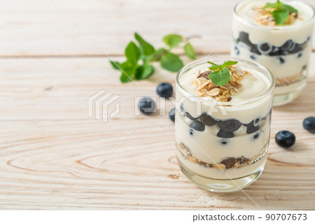 fresh blueberries and yogurt with granola fresh blueberries and yogurt with granola 90707673