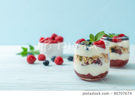 homemade raspberry and blueberry with yogurt and granola homemade raspberry and blueberry with yogurt and granola 90707674