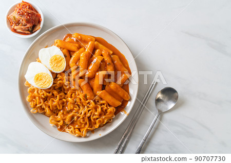 Rabokki (Ramen or Korean instant noodle and Tteokbokki) in spicy korean sauce Rabokki (Ramen or Korean instant noodle and Tteokbokki) in spicy korean sauce 90707730