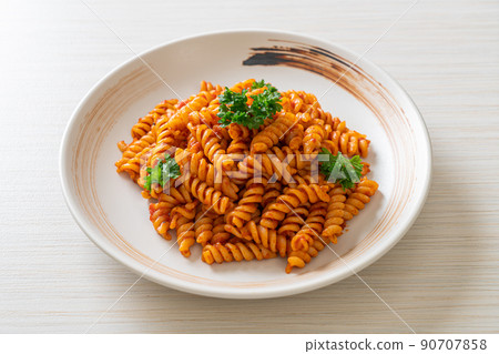 spirali or spiral pasta with tomato sauce spirali or spiral pasta with tomato sauce 90707858