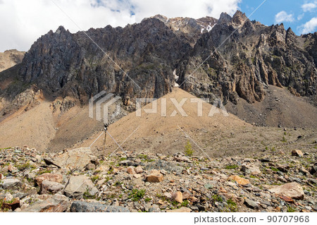 Automatic weather station in the mountains. Distant mountain range, obtaining seismic and meteorological data. 90707968