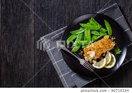 Baked Haddock with Crackers toppings and snow peas Baked Haddock with Crackers toppings and snow peas 90710184