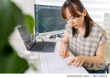 Young female first-class architect working from home Plan Young female first-class architect working from home Plan 90710851