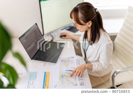 Young female engineer trade area analysis marketing research eyeglasses 90710853