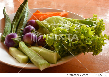 Fresh raw vegetables on a plate Fresh raw vegetables on a plate 90712782