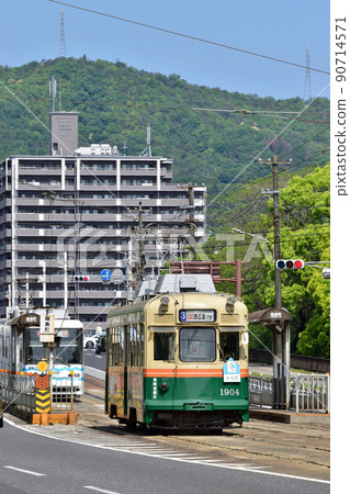 Former Kyoto streetcar running in the city Hiroshima Electric Railway 90714571