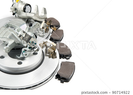 brand new brake discs, brake caliper and brake pad set for car. isolated on white with copy space. brand new brake discs, brake caliper and brake pad set for car. isolated on white with copy space. 90714922