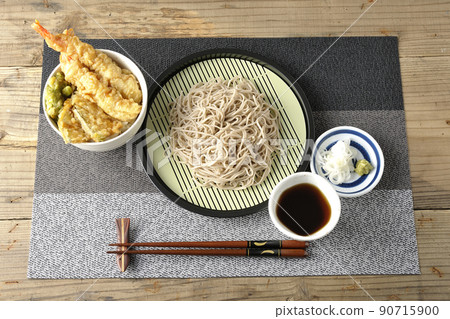 A bird's-eye view of a set of soba noodles and a bowl of tendon served in a small bowl A bird's-eye view of a set of soba noodles and a bowl of tendon served in a small bowl 90715900
