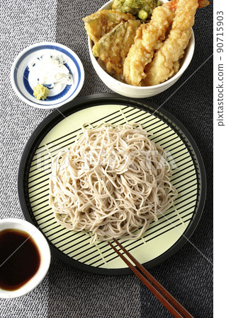 A bird's-eye view of a set of soba noodles and a bowl of tendon served in a small bowl A bird's-eye view of a set of soba noodles and a bowl of tendon served in a small bowl 90715903