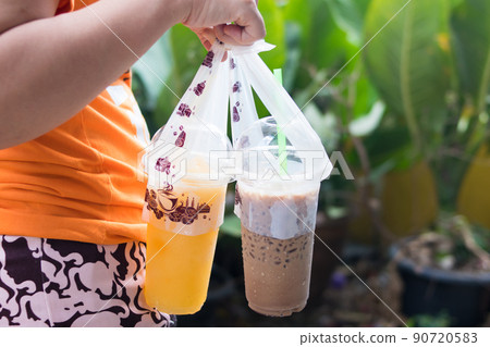 ice juice in plastic take away cups 90720583