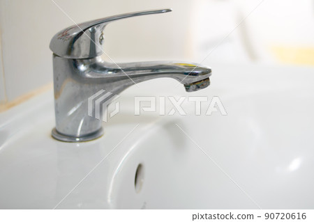 Bathroom sink tap with running water Bathroom sink tap with running water 90720616