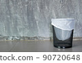 cement background with a bin 90720648