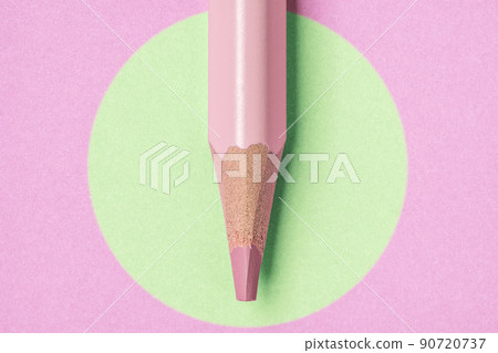 Pink pencil on pink paper with green circle shape graphic Pink pencil on pink paper with green circle shape graphic 90720737