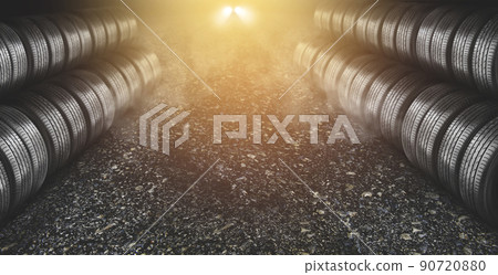 Tyre business concept,tyre row in the side with a car headlight backdrop on the asphalt road Tyre business concept,tyre row in the side with a car headlight backdrop on the asphalt road 90720880