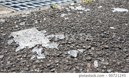 Shards of glass scattered on the ground Shards of glass scattered on the ground 90721245