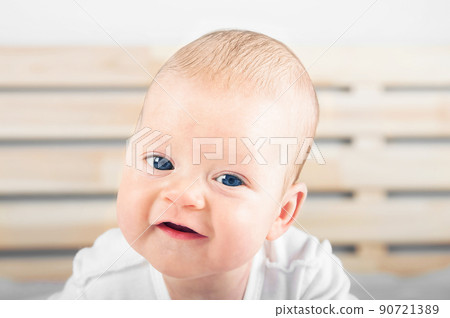 Newborn smiling without teeth close up. Baby care concept.. Newborn smiling without teeth close up. Baby care concept.. 90721389