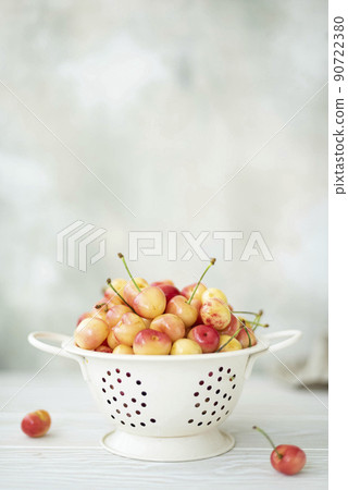 large pink cherries in a white colander large pink cherries in a white colander 90722380