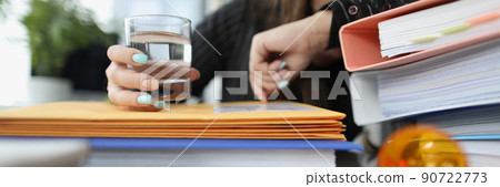 Tired woman clerk drink pill to stop headache because of big workload Tired woman clerk drink pill to stop headache because of big workload 90722773