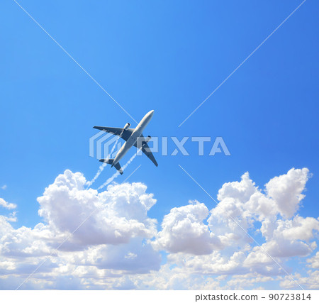 Vertical nature background with aircraft and Jet trailing smoke in the sky. Airplane and condensation trail 90723814