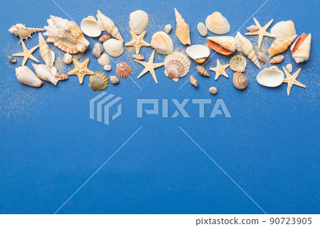 Summer time concept Flat lay composition with beautiful starfish and sea shells on colored table, top view with copy space for text 90723905