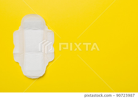 Women hygiene products or sanitary pad on colored background. Pastel color. Closeup. Empty place for text. Female daily hygiene Women hygiene products or sanitary pad on colored background. Pastel color. Closeup. Empty place for text. Female daily hygiene 90723987