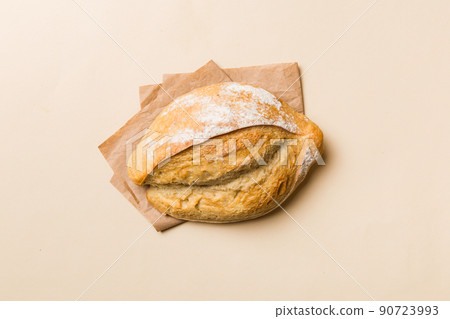 Freshly baked delicious french bread with napkin on rustic table top view. Healthy white bread loaf Freshly baked delicious french bread with napkin on rustic table top view. Healthy white bread loaf 90723993