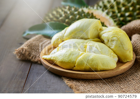 Long Laplae Durian on  wood plate,It is the most expensive and most delicious of all durians. 90724579