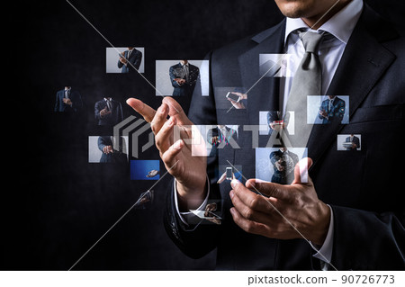 A businessman who operates a hologram A businessman who operates a hologram 90726773