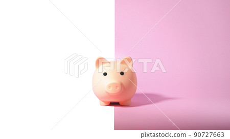 Piggy bank isolated on pink background. Saving money concept. Piggy bank isolated on pink background. Saving money concept. 90727663