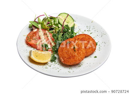 White plate with two Cheese croquettes ans salad Isolated 90728724