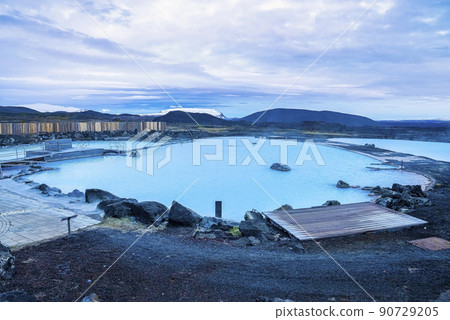 Beautiful view of natural blue lagoon in geothermal spa against cloudscape 90729205
