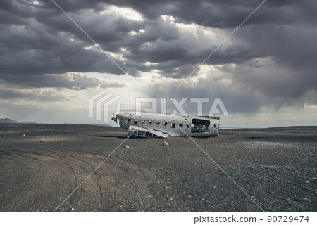 Cloudscape over broken airplane wreck at black sand beach in Solheimasandur Cloudscape over broken airplane wreck at black sand beach in Solheimasandur 90729474