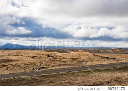 Beautiful view of road amidst landscape in mountain valley against cloudy sky Beautiful view of road amidst landscape in mountain valley against cloudy sky 90729475